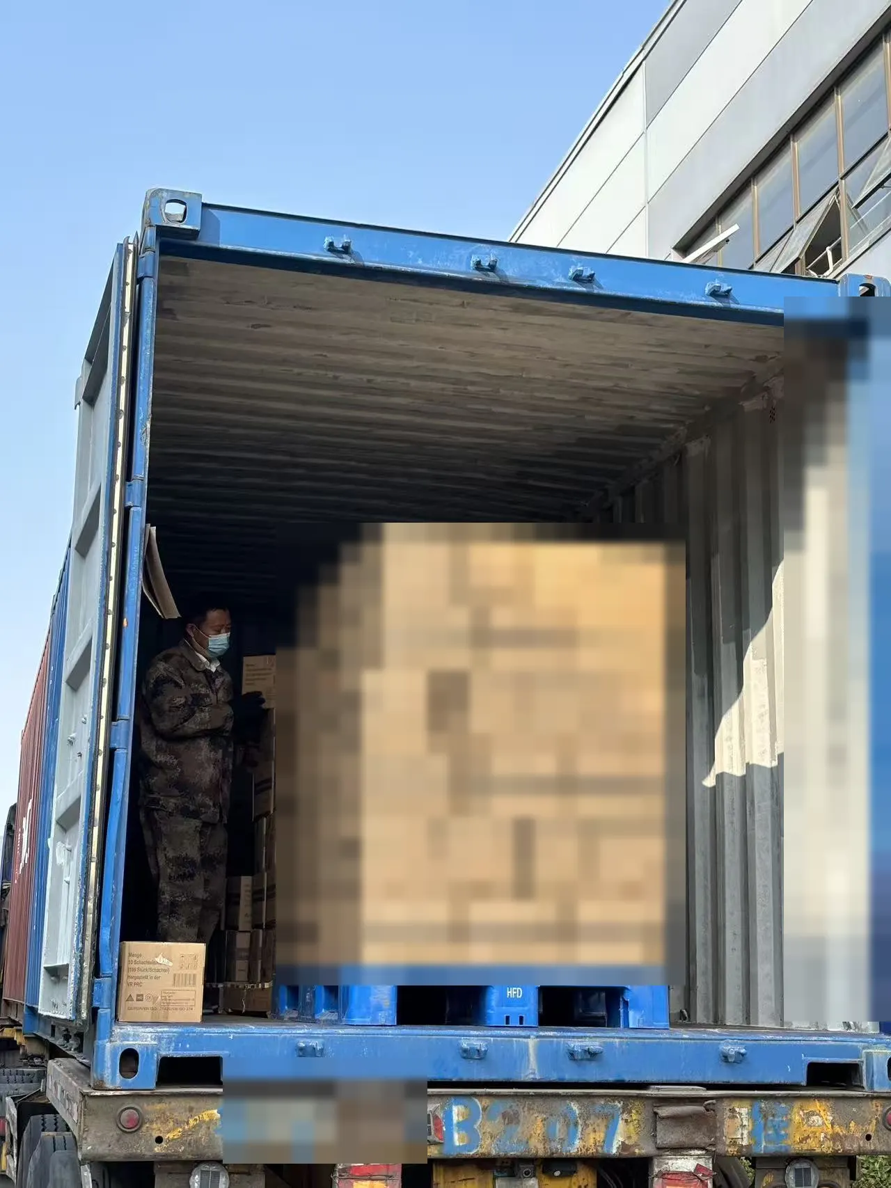 EASTGLOVES disposable glove cartons during container loading, October 2026